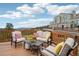 Relaxing outdoor seating on a wooden deck with scenic mountain views at 758 Chimney Creek Dr # C, Golden, CO 80401
