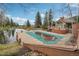 Beautiful in-ground pool with pool house and scenic pond, perfect for relaxing outdoors at 758 Chimney Creek Dr # C, Golden, CO 80401