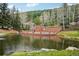 A calming pool with a pool house right on the edge of the pond, perfect for relaxation at 758 Chimney Creek Dr # C, Golden, CO 80401