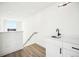 Clean and well-lit bar area with modern sink and sleek design at 1416 Pierce St, Lakewood, CO 80214