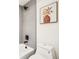 Contemporary bathroom featuring sleek design, tiled shower, and modern fixtures at 1416 Pierce St, Lakewood, CO 80214