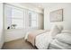 Cozy bedroom with ample natural light from the large windows at 1416 Pierce St, Lakewood, CO 80214