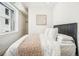 Bright, minimalist bedroom with large windows and neutral color palette at 1416 Pierce St, Lakewood, CO 80214
