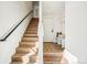 Modern entryway features hardwood stairs, coat hooks, and a seating area with natural lighting at 1416 Pierce St, Lakewood, CO 80214