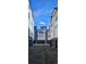 A view of the townhome garages with a bright blue sky overhead at 1416 Pierce St, Lakewood, CO 80214