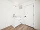 Hallway with white cabinetry and a modern sink setup at 1416 Pierce St, Lakewood, CO 80214