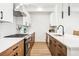 Modern kitchen featuring quartz countertops, stainless steel appliances, and stylish cabinetry at 1416 Pierce St, Lakewood, CO 80214