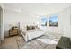 Bright main bedroom boasts large windows, neutral tones, and stylish decor at 1416 Pierce St, Lakewood, CO 80214