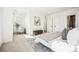 Airy main bedroom featuring an accent chair and tasteful wall art at 1416 Pierce St, Lakewood, CO 80214