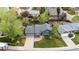 Charming blue home with a gray roof, a well-manicured lawn, and mature trees in a desirable neighborhood at 21524 E Powers Pl, Centennial, CO 80015