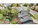 Aerial view of the home showing the expansive backyard, mature trees, and neighborhood at 21524 E Powers Pl, Centennial, CO 80015