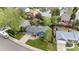Aerial view of the property featuring a well-manicured lawn, mature trees, and a spacious driveway at 21524 E Powers Pl, Centennial, CO 80015