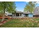 Lovely backyard featuring a patio area, green lawn, and charming landscaping at 21524 E Powers Pl, Centennial, CO 80015
