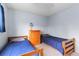 Simple bedroom with matching twin beds, neutral carpet, and a wooden dresser at 21524 E Powers Pl, Centennial, CO 80015