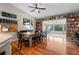 Open-concept dining room featuring hardwood floors, stylish table with seating for eight, and great lighting at 21524 E Powers Pl, Centennial, CO 80015