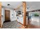 Well-lit kitchen featuring white cabinets, stainless steel appliances, and hardwood floors at 21524 E Powers Pl, Centennial, CO 80015