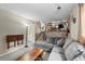 Comfortable living room with a gray sectional sofa, carpet, and wooden coffee table at 21524 E Powers Pl, Centennial, CO 80015