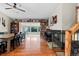 Open-concept living room featuring hardwood floors, built-in bookshelves, and abundant natural light at 21524 E Powers Pl, Centennial, CO 80015