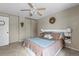 Comfortable main bedroom features a ceiling fan, closet, and a neutral colored wall at 21524 E Powers Pl, Centennial, CO 80015