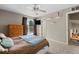 Main bedroom features a large bed, a dresser, and a large window at 21524 E Powers Pl, Centennial, CO 80015