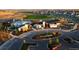An aerial view of community center, pool, and surrounding neighborhood with lush landscaping at 27694 E Byers Ave, Aurora, CO 80018