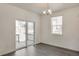 Dining area with access to patio, large windows, and hardwood flooring with lots of natural light at 27694 E Byers Ave, Aurora, CO 80018