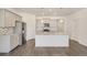 Modern kitchen with stainless steel appliances, gray cabinets, granite counters, and kitchen island at 27694 E Byers Ave, Aurora, CO 80018