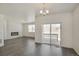 Bright living area with modern fireplace and access to outdoor space with large sliding glass doors at 27694 E Byers Ave, Aurora, CO 80018