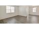 Minimalist living room with sliding glass doors, offering plenty of natural light and a modern feel at 27694 E Byers Ave, Aurora, CO 80018