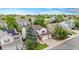 Charming two-story home featuring a well-manicured lawn, a two-car garage, and a welcoming front porch with porch swings at 2795 Signal Creek Dr, Thornton, CO 80241