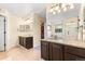 Bathroom with granite countertops, double sinks, and a walk-in shower with glass enclosure at 2795 Signal Creek Dr, Thornton, CO 80241