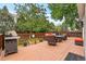 Large deck with grill, outdoor seating, and lush green surroundings perfect for entertaining at 2795 Signal Creek Dr, Thornton, CO 80241