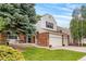 Charming home with brick accents, well-manicured lawn, and inviting front porch, perfect for enjoying the outdoors at 2795 Signal Creek Dr, Thornton, CO 80241