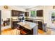 Updated kitchen with granite countertops, stainless appliances, central island and hardwood floors at 2795 Signal Creek Dr, Thornton, CO 80241