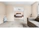 Bright living room offers glimpse of main bedroom with decorative tray ceiling and neutral decor at 2795 Signal Creek Dr, Thornton, CO 80241