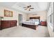 Spacious main bedroom boasts decorative tray ceiling, soft carpeting, and neutral wall decor at 2795 Signal Creek Dr, Thornton, CO 80241