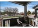 Cozy outdoor balcony with seating, offering a view of the street and nearby buildings at 1312 Independence St # 3, Lakewood, CO 80215
