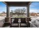 Comfortable balcony with outdoor seating and a grill, overlooking the street and surroundings at 1312 Independence St # 3, Lakewood, CO 80215