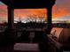 Serene sunset view from the balcony with comfortable seating and a built-in grill at 1312 Independence St # 3, Lakewood, CO 80215