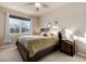 Sunlit bedroom with a ceiling fan, comfy bed, and serene decor for a restful retreat at 1312 Independence St # 3, Lakewood, CO 80215