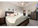 Well-lit bedroom with a plush bed, side tables, and tasteful wall decorations at 1312 Independence St # 3, Lakewood, CO 80215