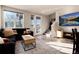 Cozy living room with a large window, comfortable sofa, and modern decor accents at 1312 Independence St # 3, Lakewood, CO 80215