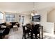 Open concept living and dining area with modern furnishings and plenty of natural light at 1312 Independence St # 3, Lakewood, CO 80215