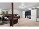 Spacious basement living area with comfortable seating and a large tv at 17540 Caribou Dr, Monument, CO 80132