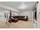 Basement lounge showcasing a leather sectional sofa, and a side table with décor at 17540 Caribou Dr, Monument, CO 80132