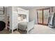 Bedroom with bunkbeds and a large window with access to balcony at 17540 Caribou Dr, Monument, CO 80132