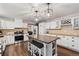 Charming kitchen with white cabinets, stainless steel appliances, and a large island at 17540 Caribou Dr, Monument, CO 80132