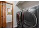 Modern laundry room equipped with a new washer and dryer with ample room to move around at 17540 Caribou Dr, Monument, CO 80132