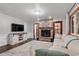 Cozy living room with a stone fireplace, a large TV, and a comfortable seating area at 17540 Caribou Dr, Monument, CO 80132