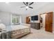 Spacious main bedroom featuring a ceiling fan, large windows and an attached wardrobe at 17540 Caribou Dr, Monument, CO 80132